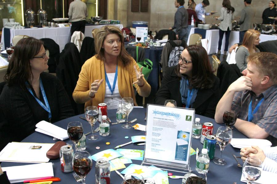 Advisers network at the 2014 CSPA Spring Advisers Awards Luncheon before the program begins.