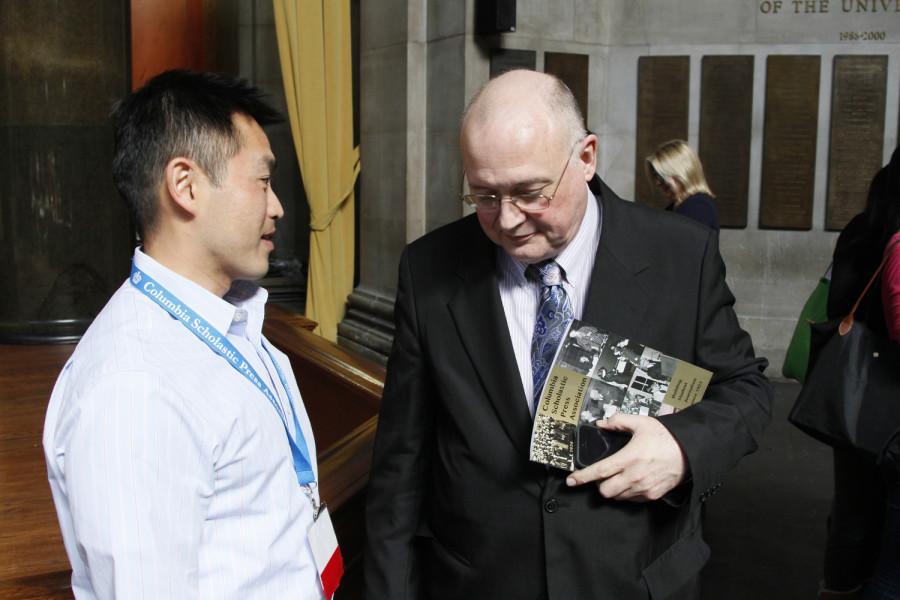 CSPA Executive Director Ed Sullivan (on the right) speaks with Steven Le, an adviser of the 2014 EJS Award recipient, the staff of the Global Vantage Magazine.